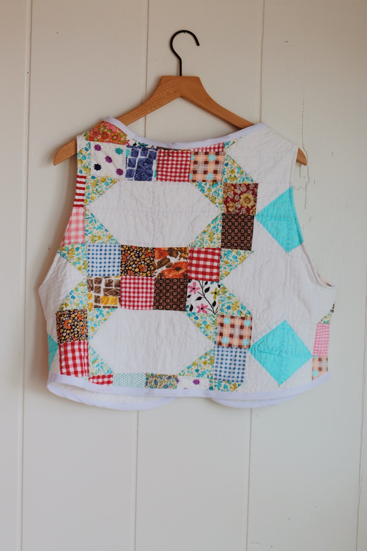 white & colorful vest