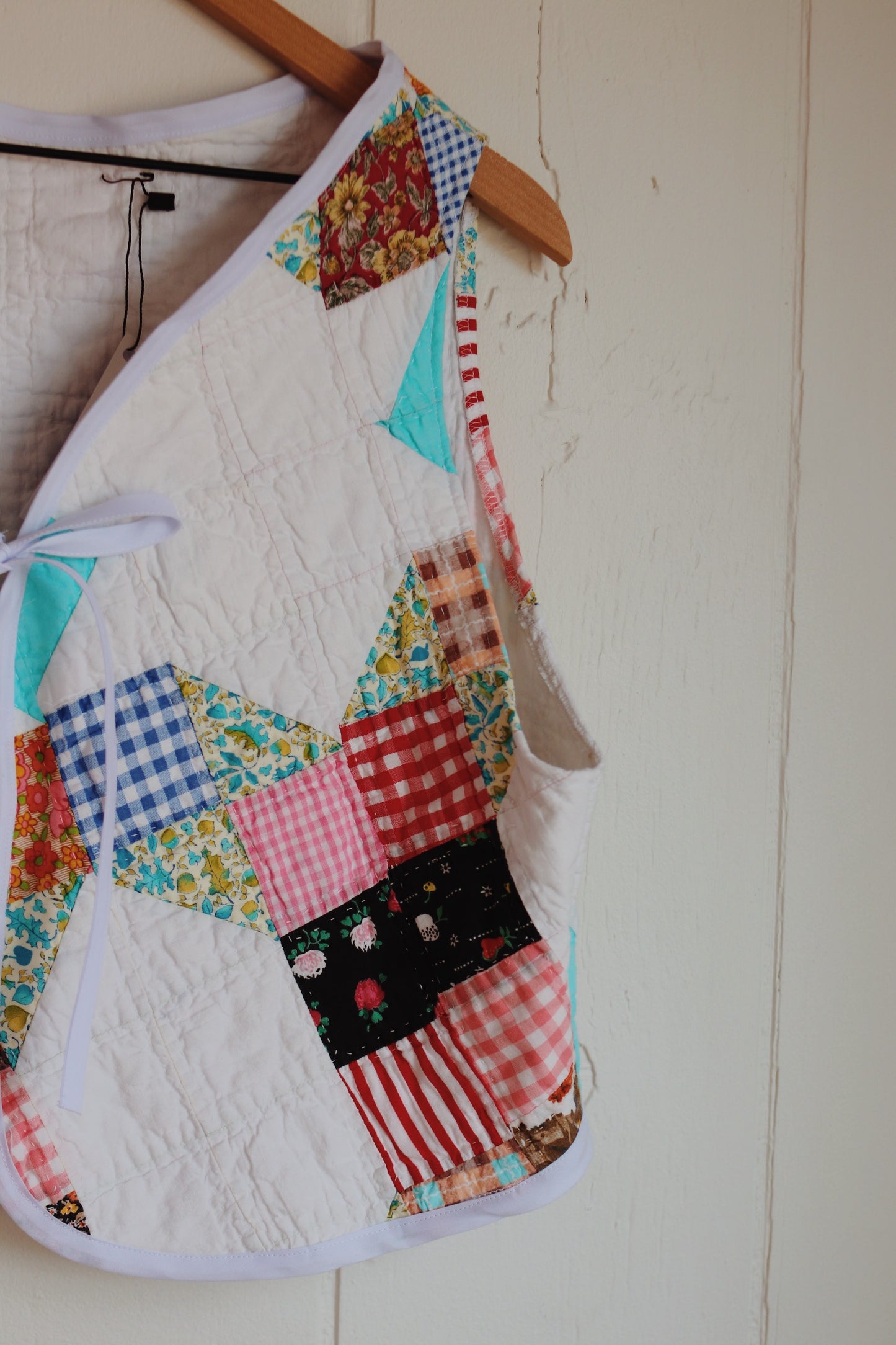 white & colorful vest