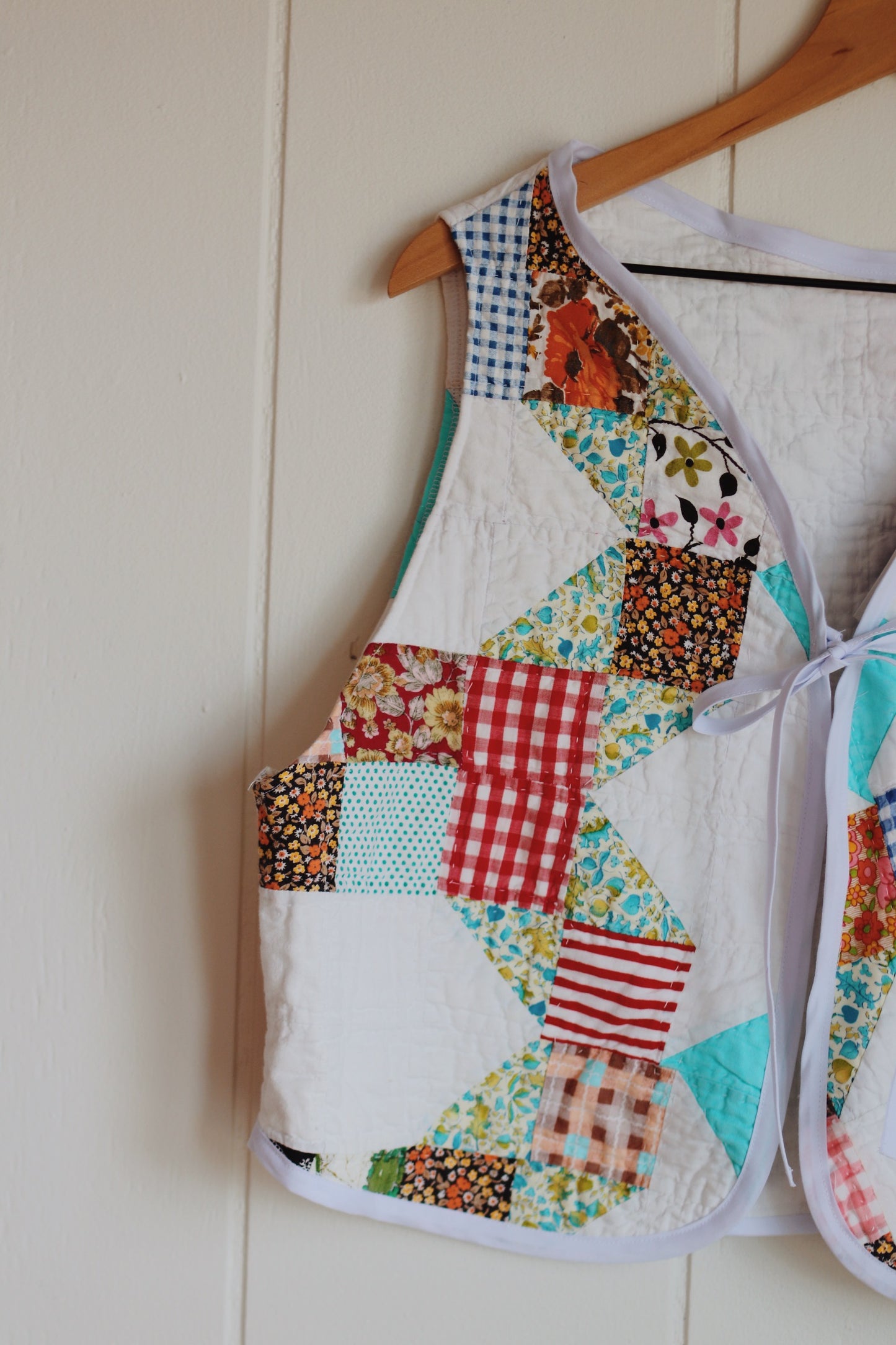 white & colorful vest