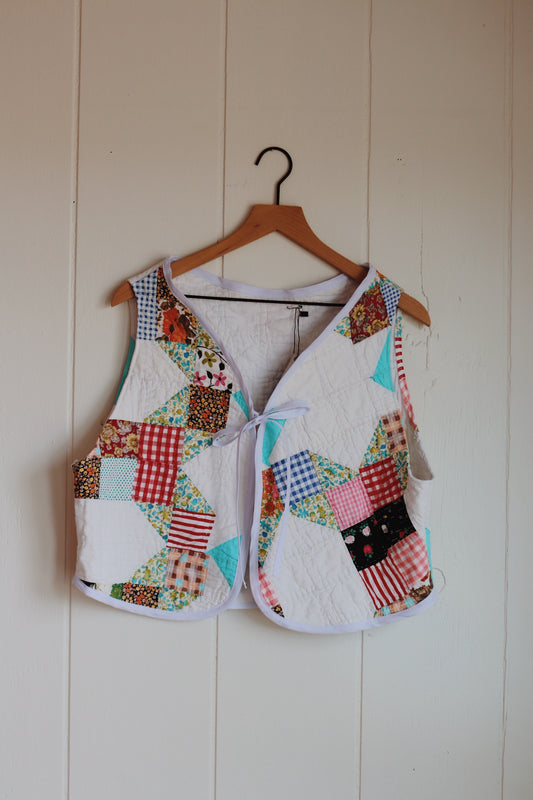 white & colorful vest