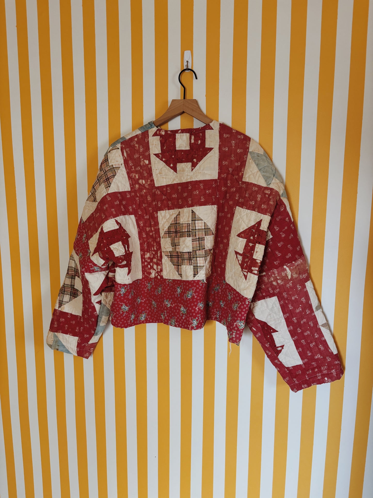 tattered red quilt coat