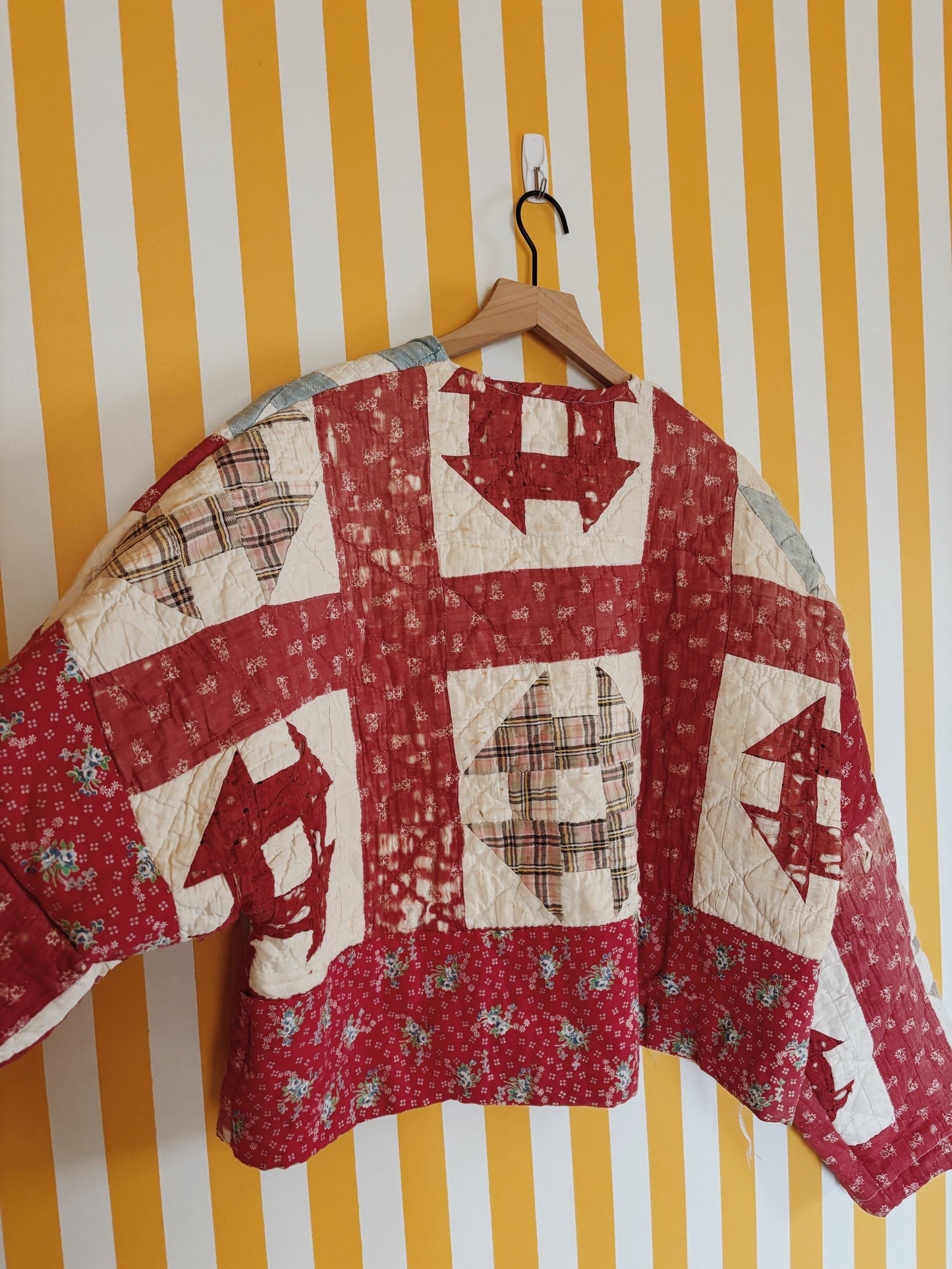 tattered red quilt coat